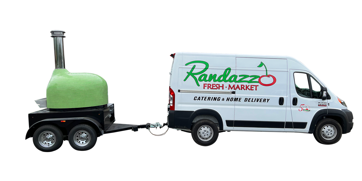Randazzo Fresh Market catering van towing the green wood-fired mobile pizza oven